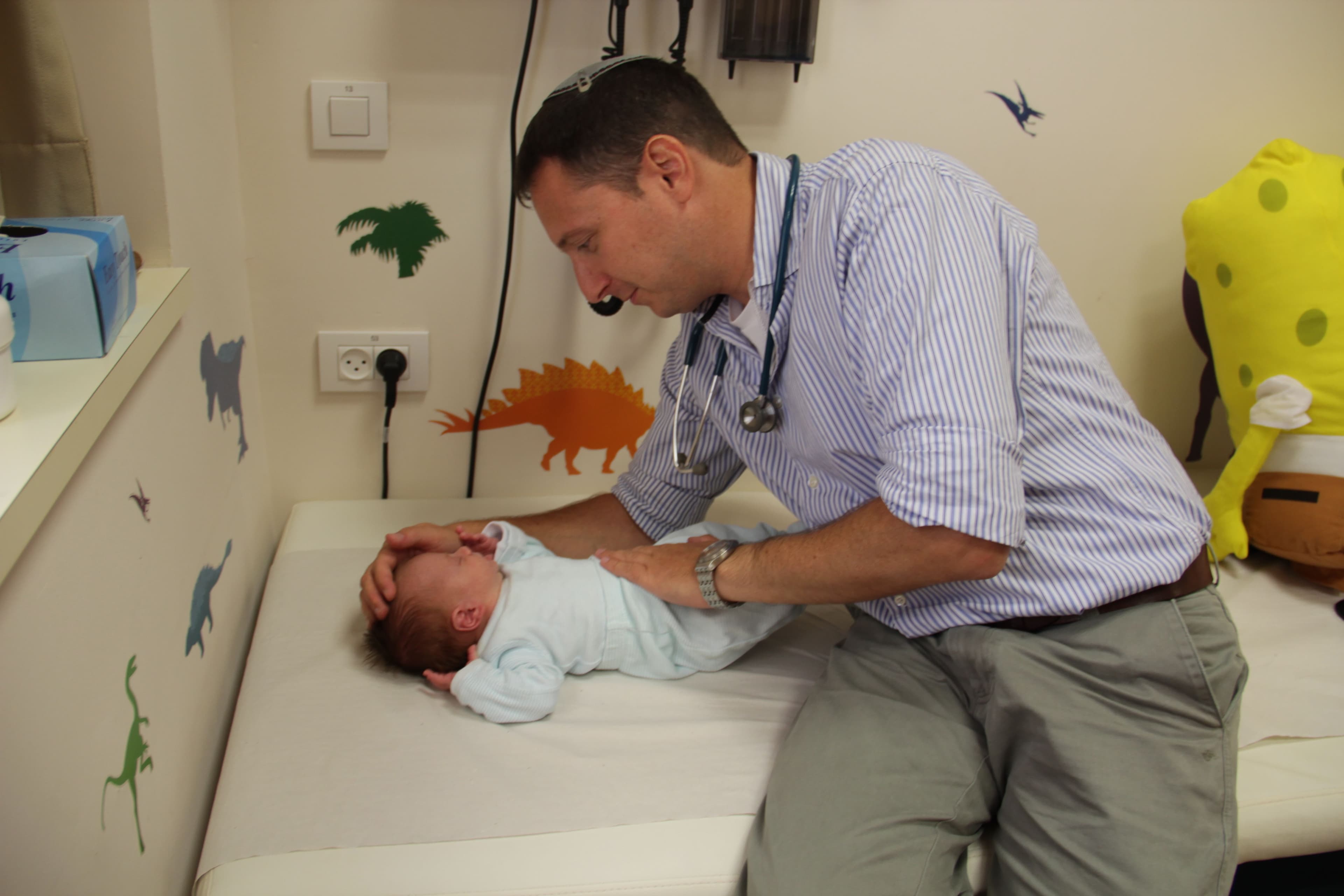 Pediatric care - doctor with baby